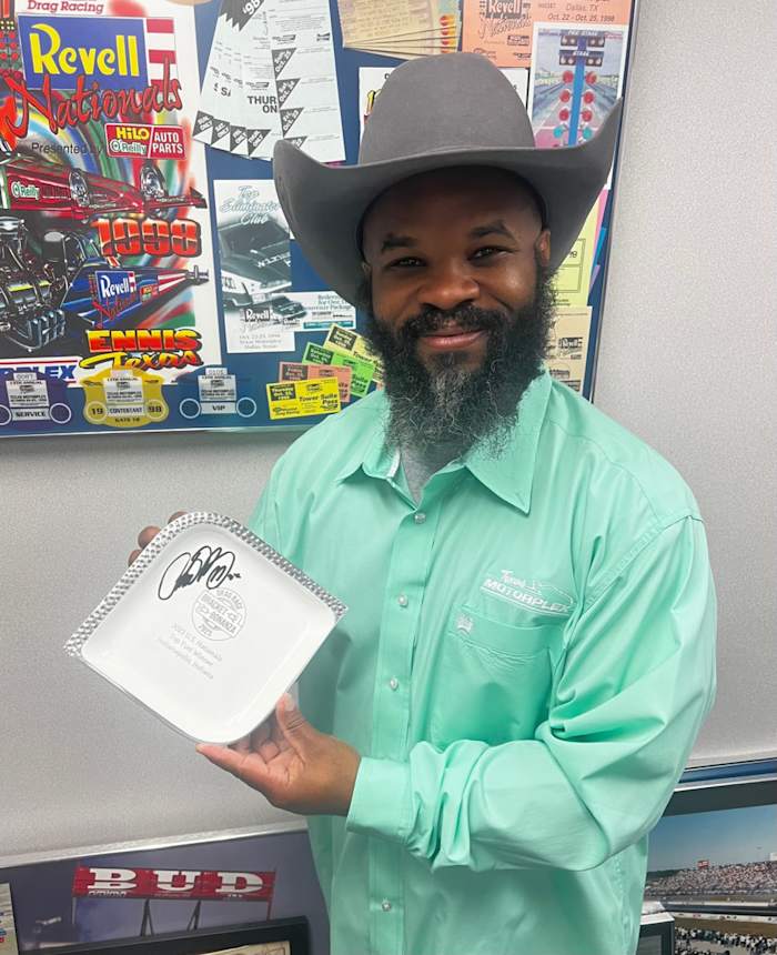 DRBB Top Fuel U.S. Nationals winner Demarcus R. hold his Antron Brown signed plaque.